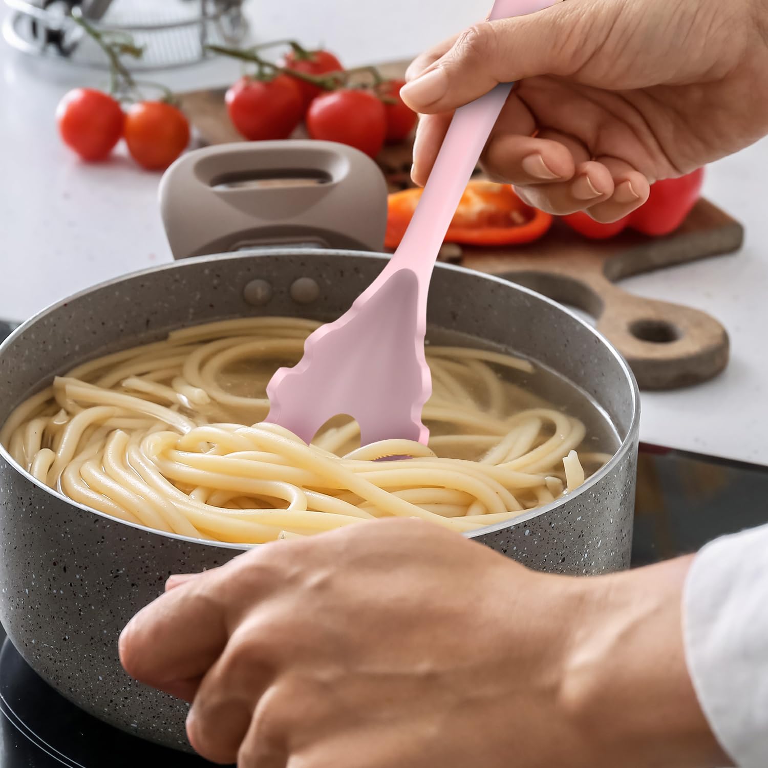 AOTHOD silicone whisk in pink for efficient mixing.