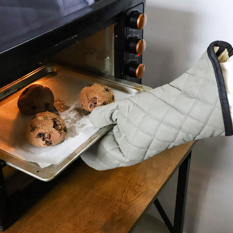 ARCLIBER Oven Mitts tested near a hot pan demonstrating heat resistance