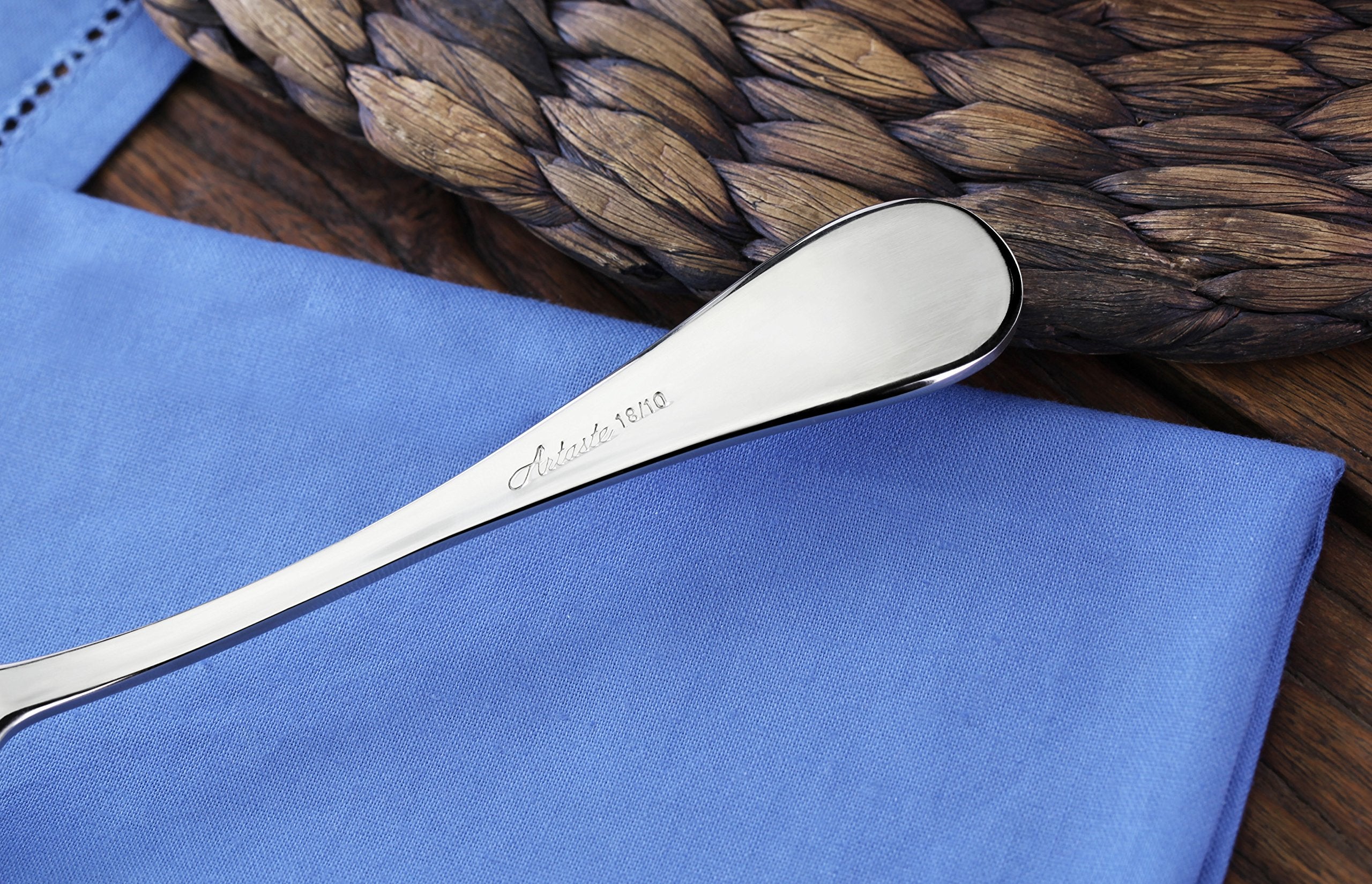 Artaste Rain dinner spoon next to plate ready for serving