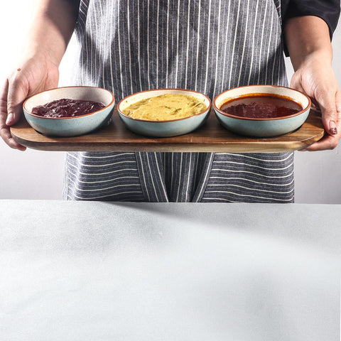 Artena wooden tray nests bowls securely to protect surfaces during meals