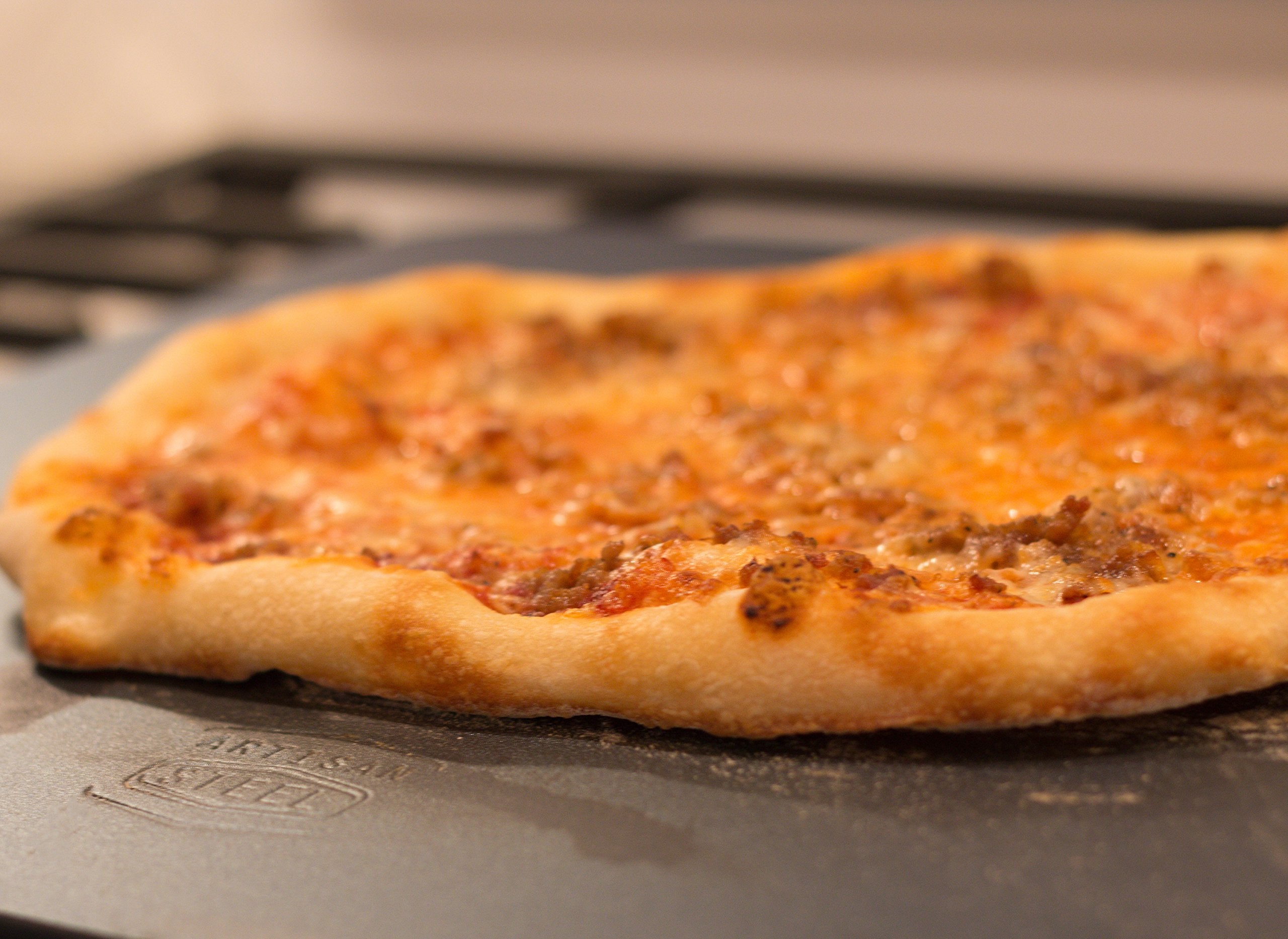 Closeup of blistered crust on Artisan Steel showing even heat transfer.