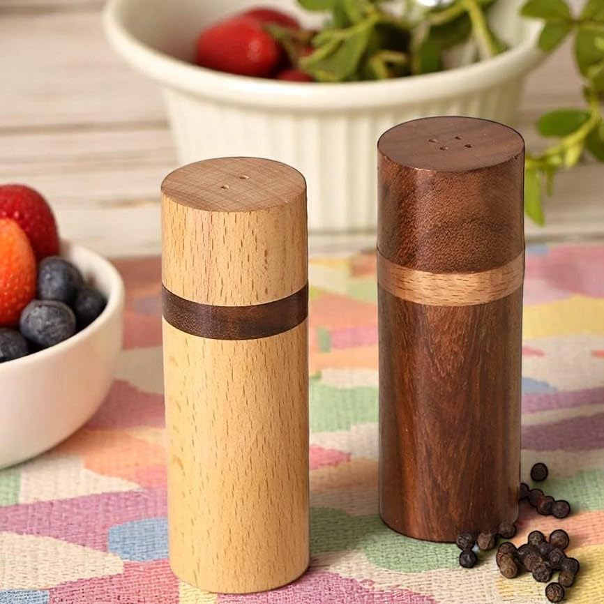 Artistic India rosewood pepper shaker emphasizes rich color and durable finish.