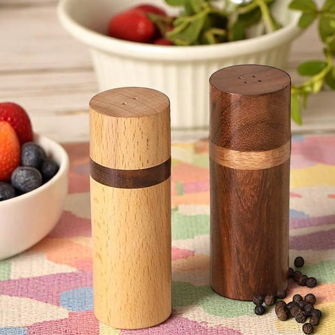 Artistic India rosewood pepper shaker emphasizes rich color and durable finish.