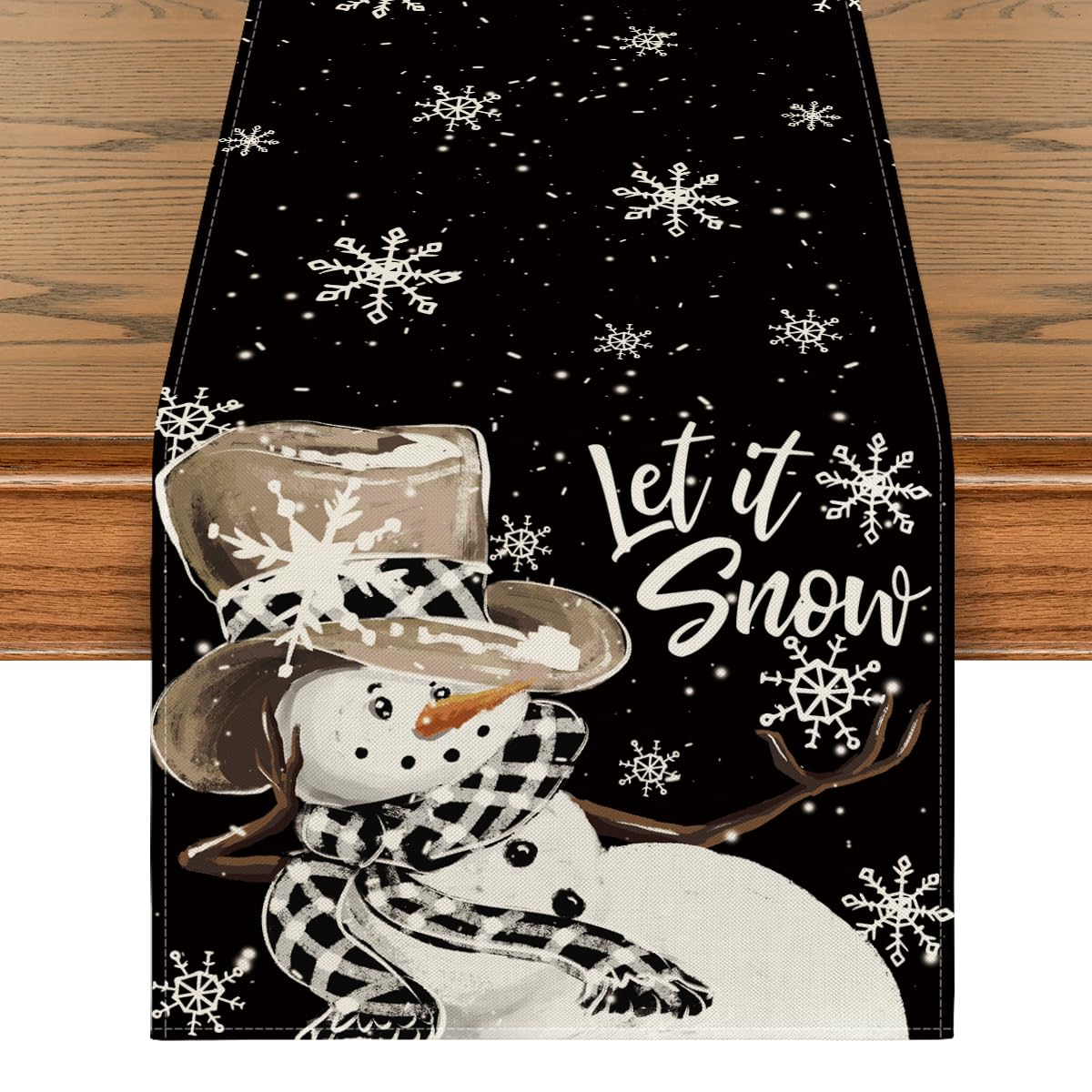 Artoid Mode black snowman snowflake table runner closeup showing vibrant print.