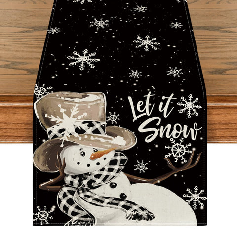 Artoid Mode black snowman snowflake table runner closeup showing vibrant print.