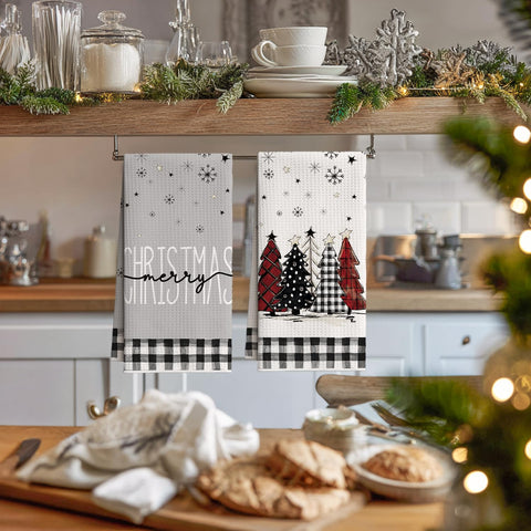 Artoid Mode towels folded stack, compact storage with vibrant holiday design.
