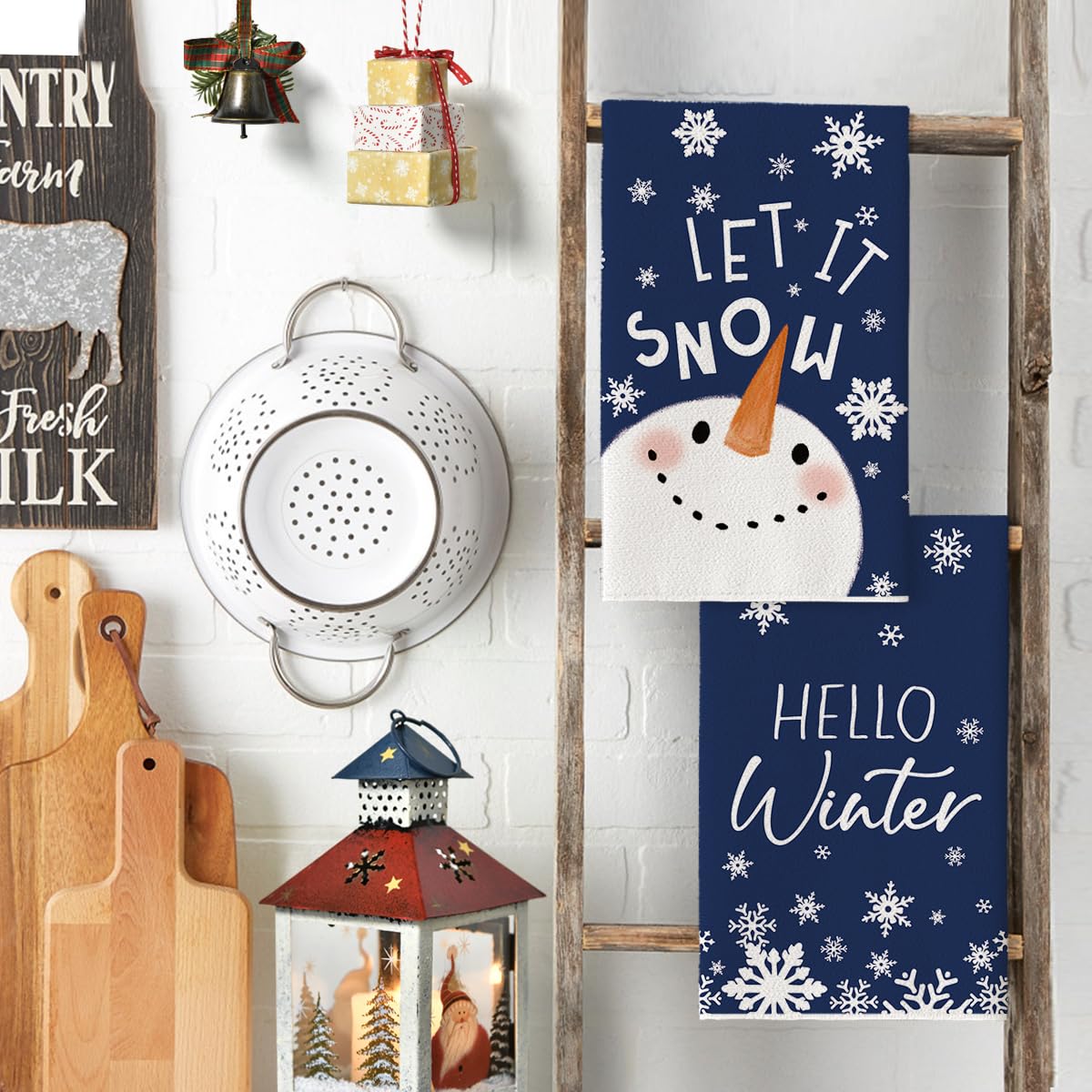 Blue snowflake hello winter towels feature a cozy pattern for kitchen ambiance.