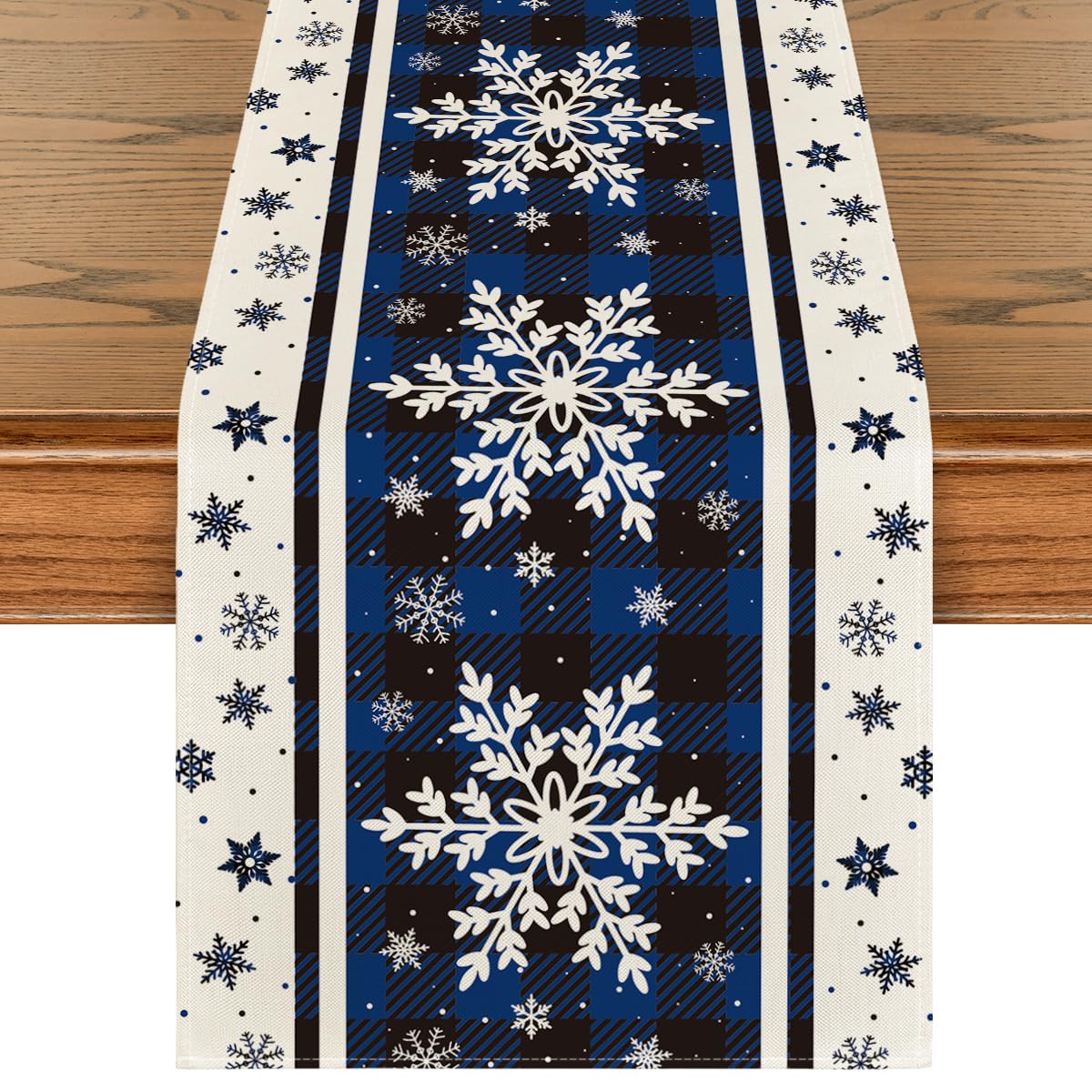 Artoid Mode Buffalo Plaid Snowflakes Blue table runner adds festive color and protects surfaces.