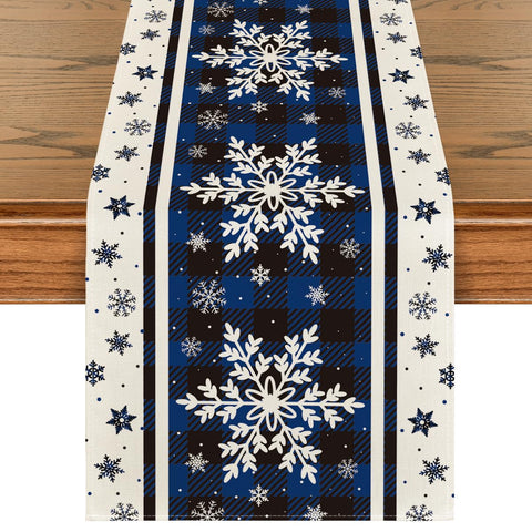 Artoid Mode Buffalo Plaid Snowflakes Blue table runner adds festive color and protects surfaces.