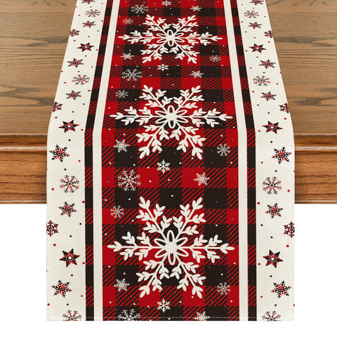 Artoid Mode buffalo plaid snowflakes table runner adds festive charm to holiday dinners.