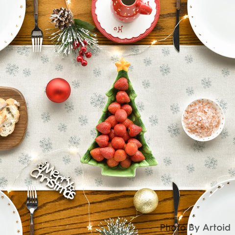 Artoid Mode beige runner complements Christmas table decor.