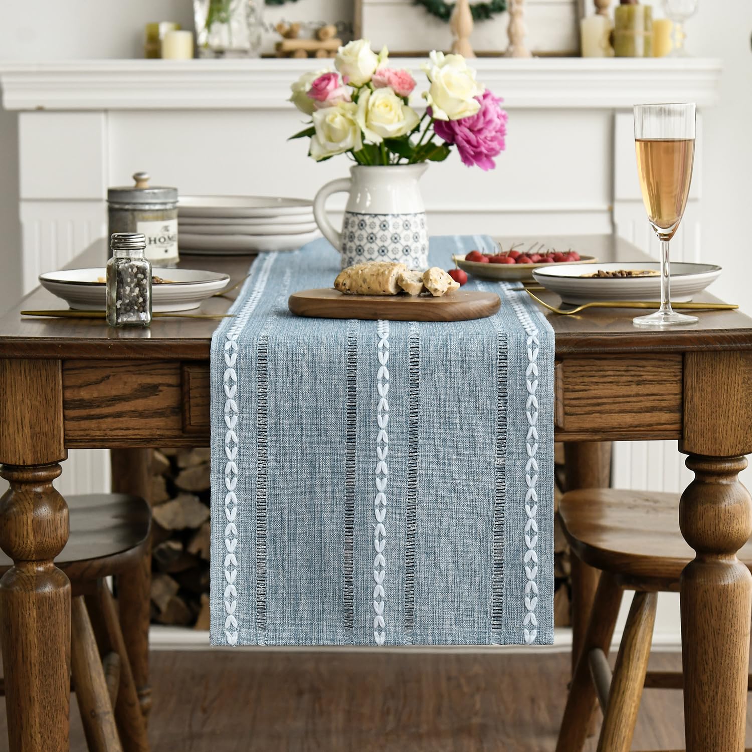 Artoid Mode dusty blue table runner on dining table creates a refined centerpiece