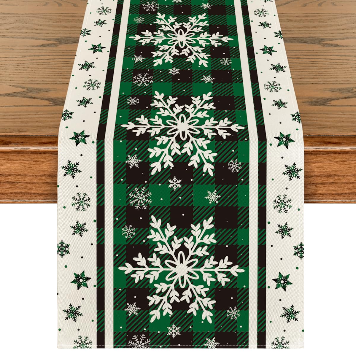 Artoid Mode green buffalo plaid snowflakes table runner adds festive charm to tables.