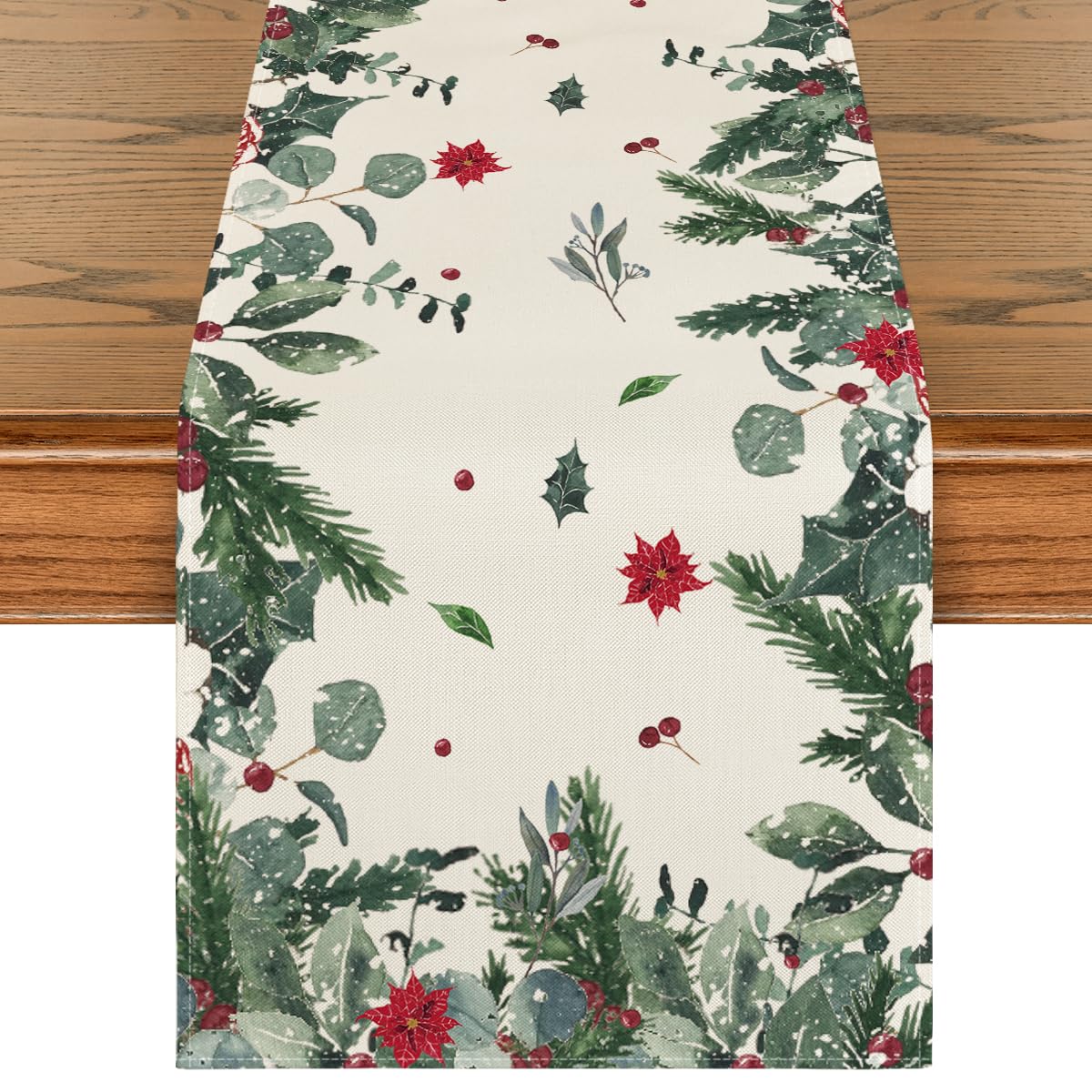 Artoid Mode table runner close-up showing green leaves and poinsettia for festive ambiance