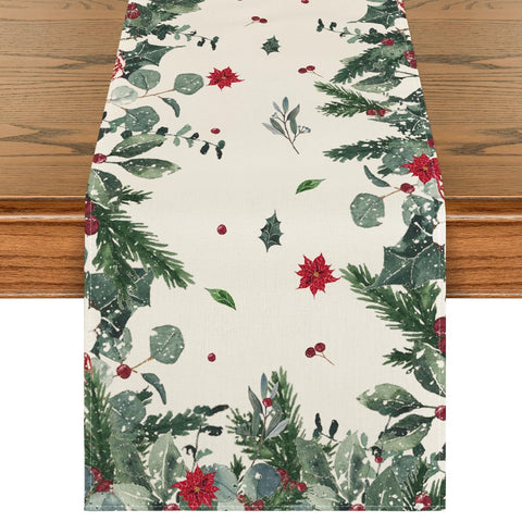 Artoid Mode table runner close-up showing green leaves and poinsettia for festive ambiance