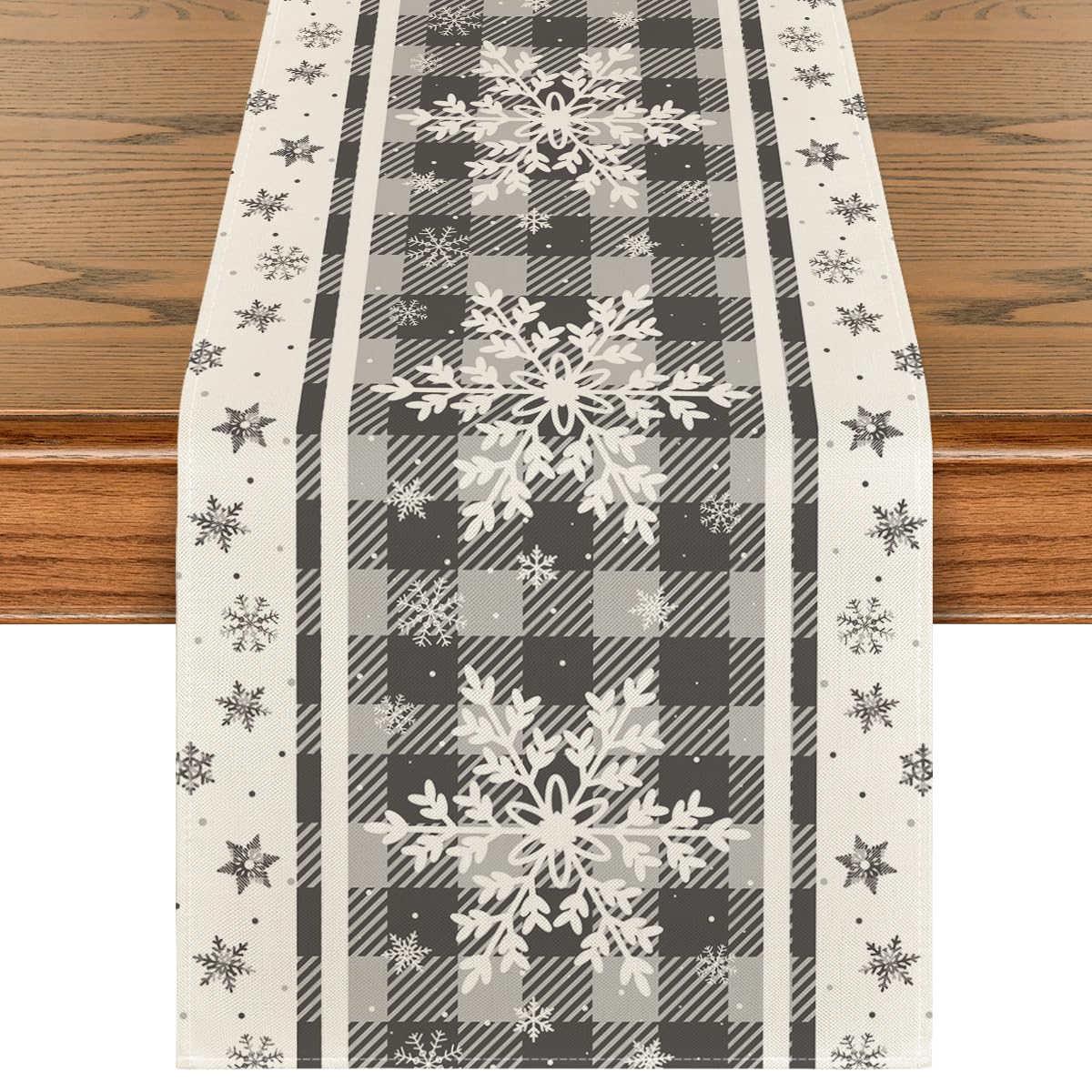 Artoid Mode grey buffalo plaid snowflakes table runner enhances holiday dining aesthetics and surface protection.