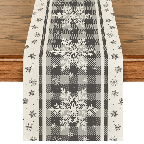 Artoid Mode grey buffalo plaid snowflakes table runner enhances holiday dining aesthetics and surface protection.