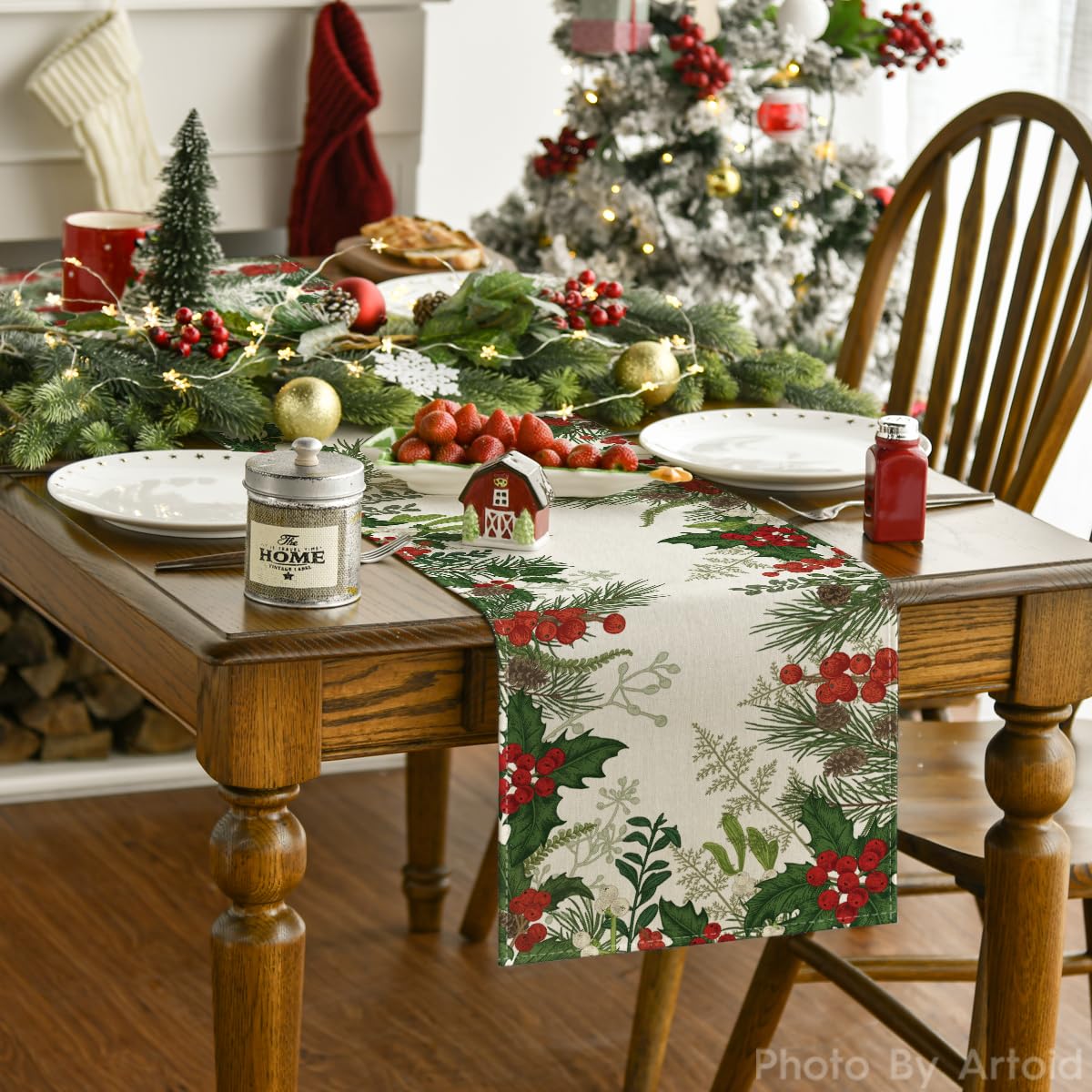 Artoid Mode holly pine cone pattern print enhances holiday table setting.