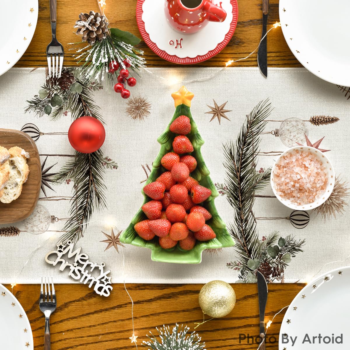 Artoid Mode holly pine cone pattern table runner brightens seasonal dinners