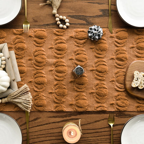 Artoid Mode jacquard pumpkin pattern detail enhances festive table decor.