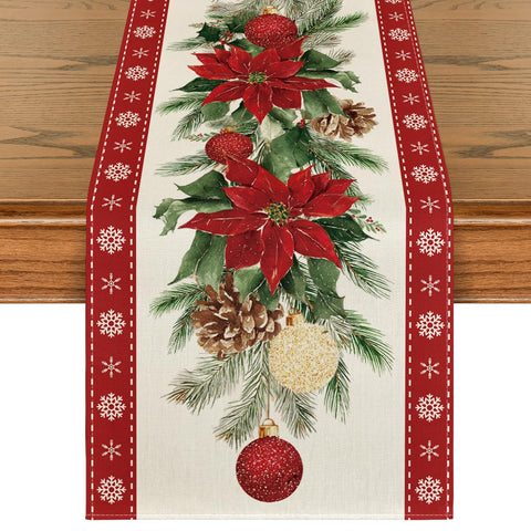 Artoid Mode poinsettia pine branch table runner adds festive charm and protects tabletops.