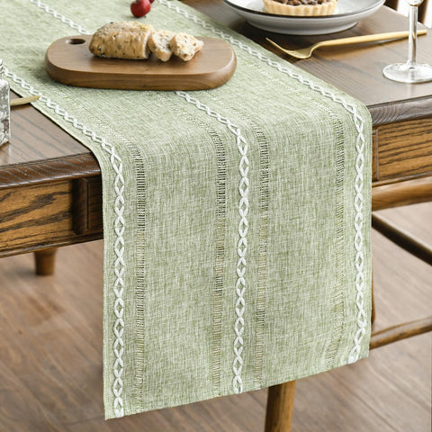 Artoid Mode sage green rustic table runner on wood table, adds subtle elegance
