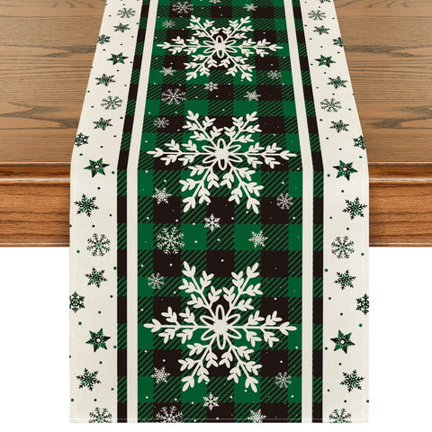 Artoid Mode table runner in green buffalo plaid snowflakes enhances festive dining.