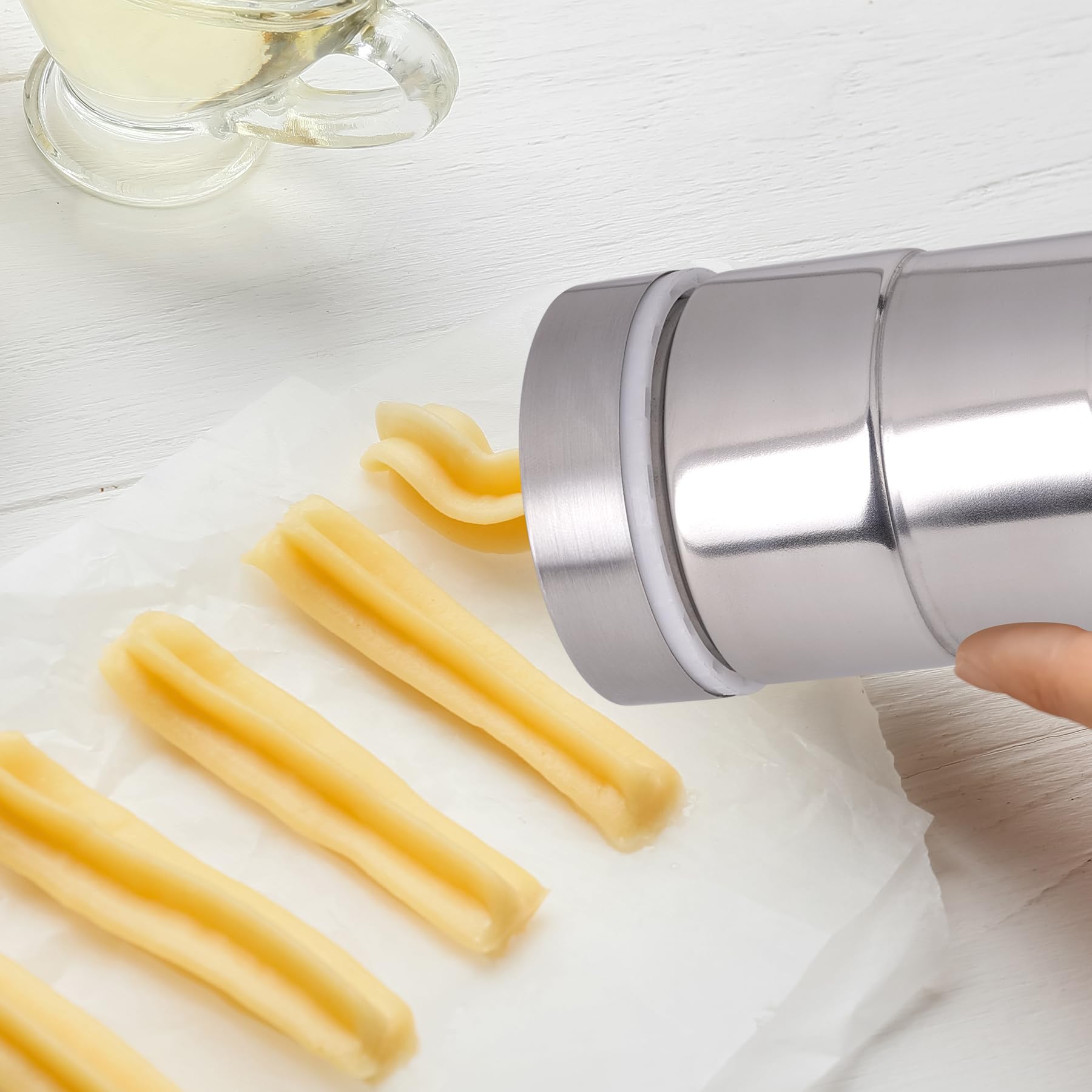 Aschef churro maker two-nozzle close-up showcasing versatile shaping options for treats