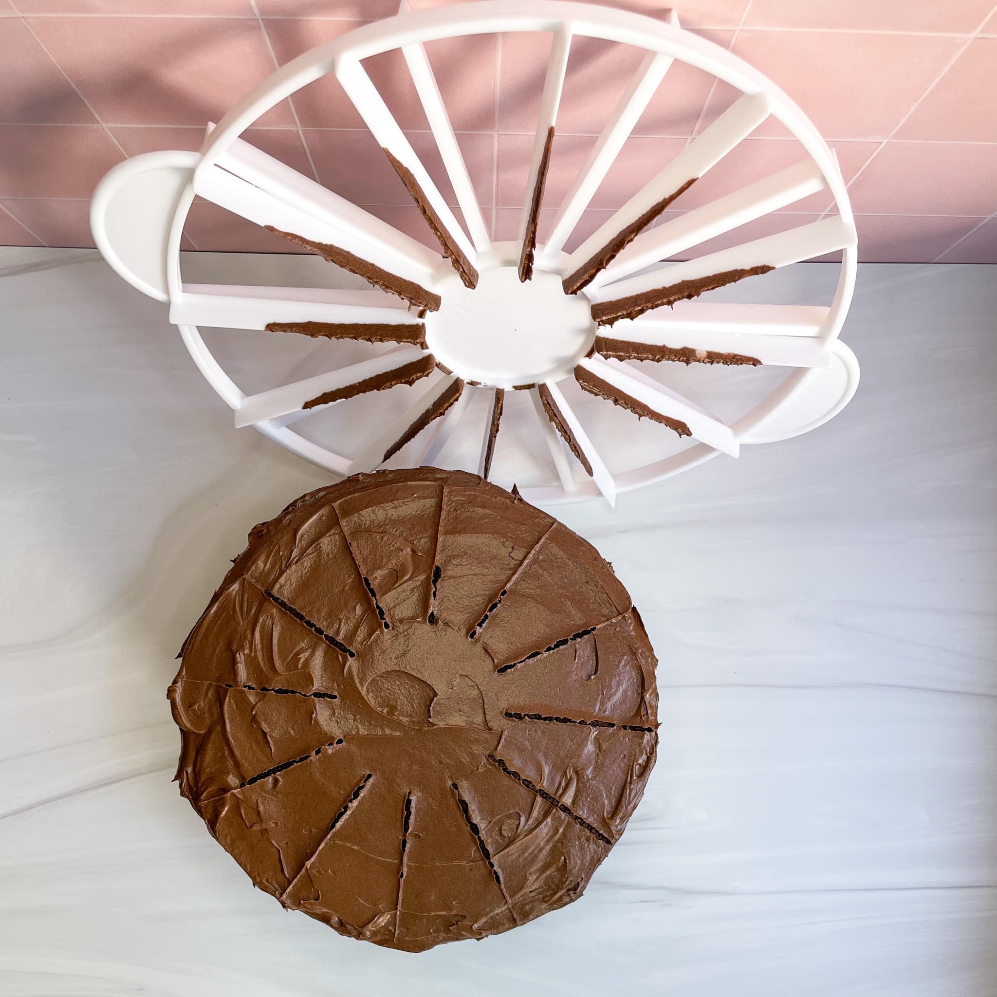 Ateco cake portion marker pressed into a flat frosted cake