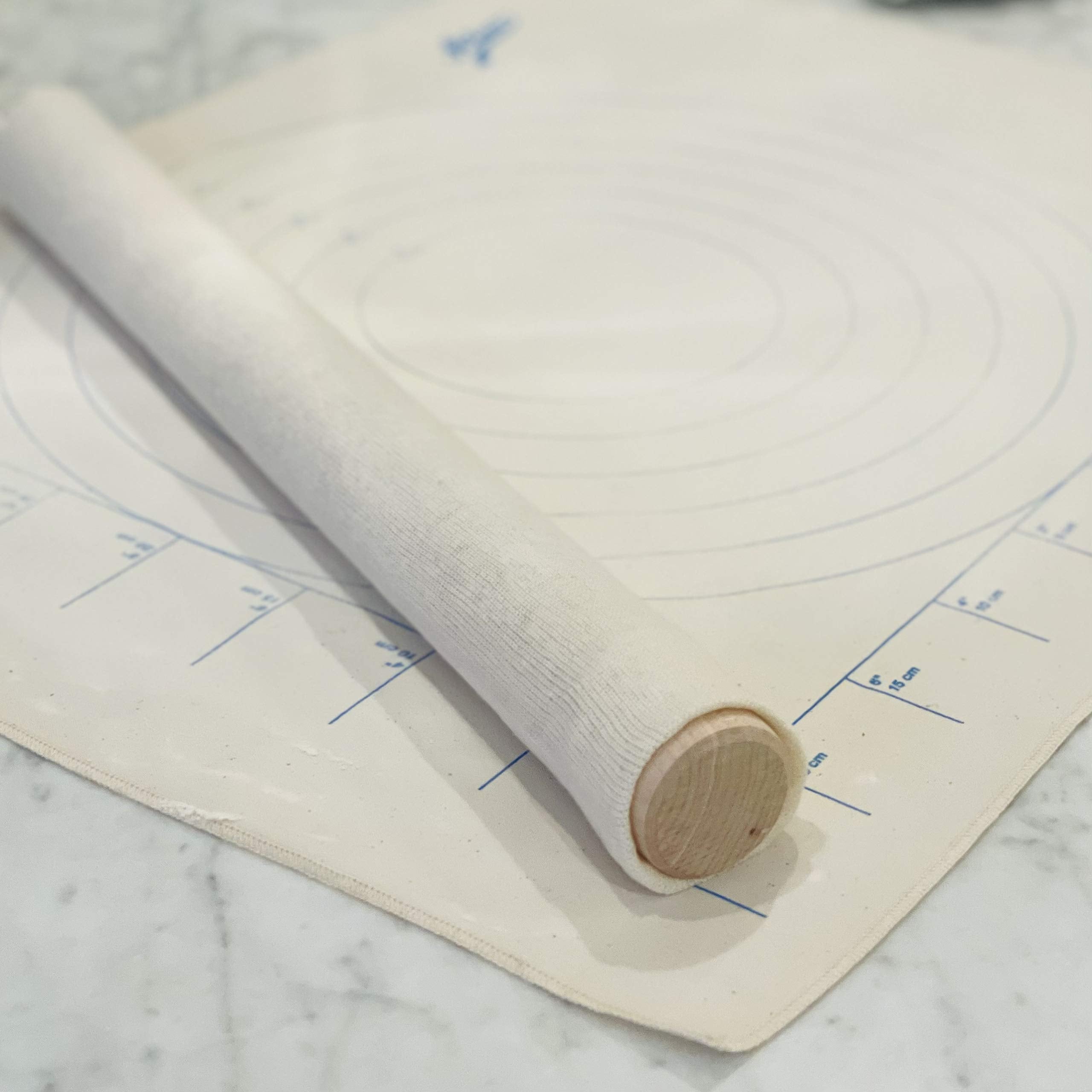 Ateco silk-screened circles guide dough sizing precisely.