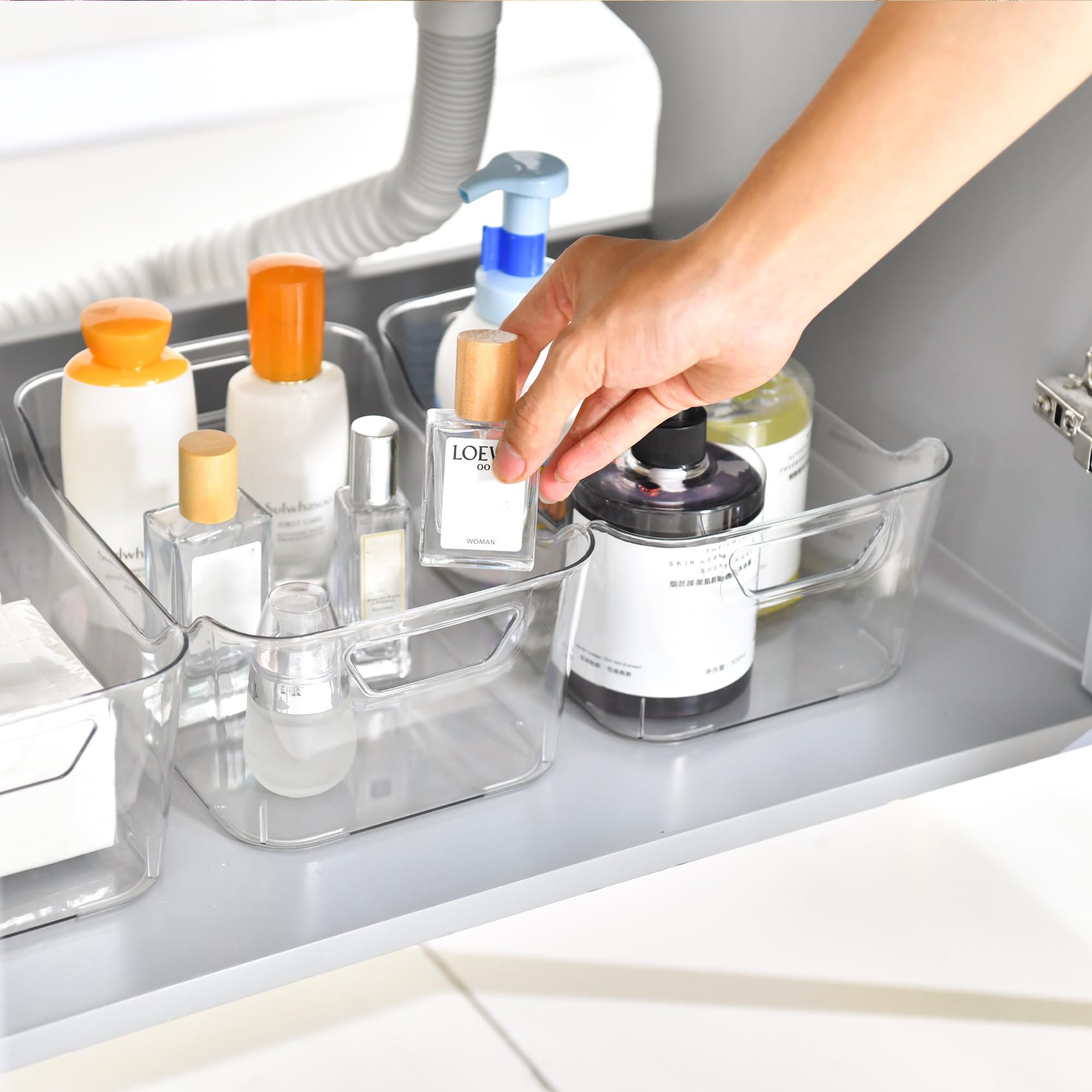 Attelite clear bin laundry-room organizer streamlines detergents and tools access.