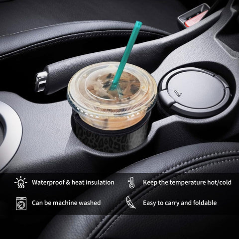 AUEKLLW leopard coffee sleeve in hand, secure grip for spill-free drinking.
