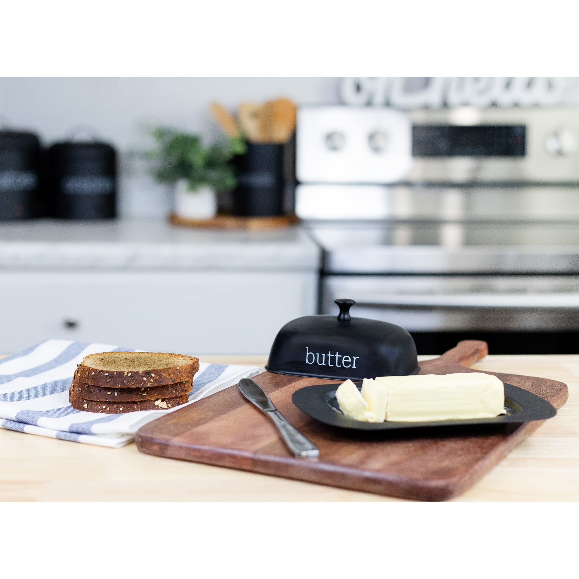 AuldHome Design enamelware black butter dish set in a cozy kitchen scene