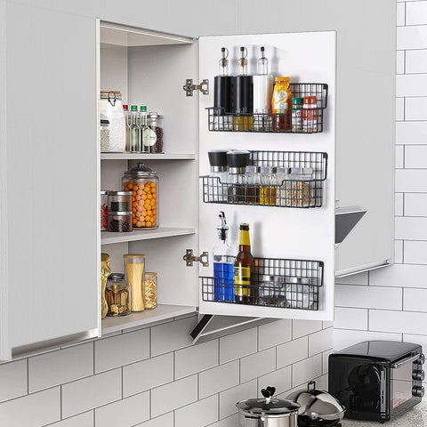 AURIKAR black spice rack mounted on a wall for easy cooking access.