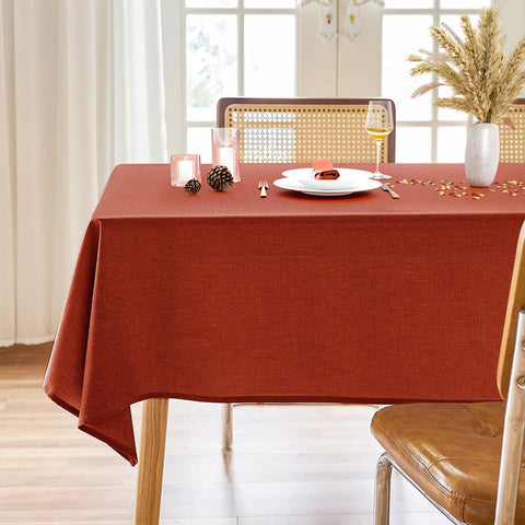 AUSSPVOCT faux linen fall tablecloth in burnt orange on a rectangular table for gatherings