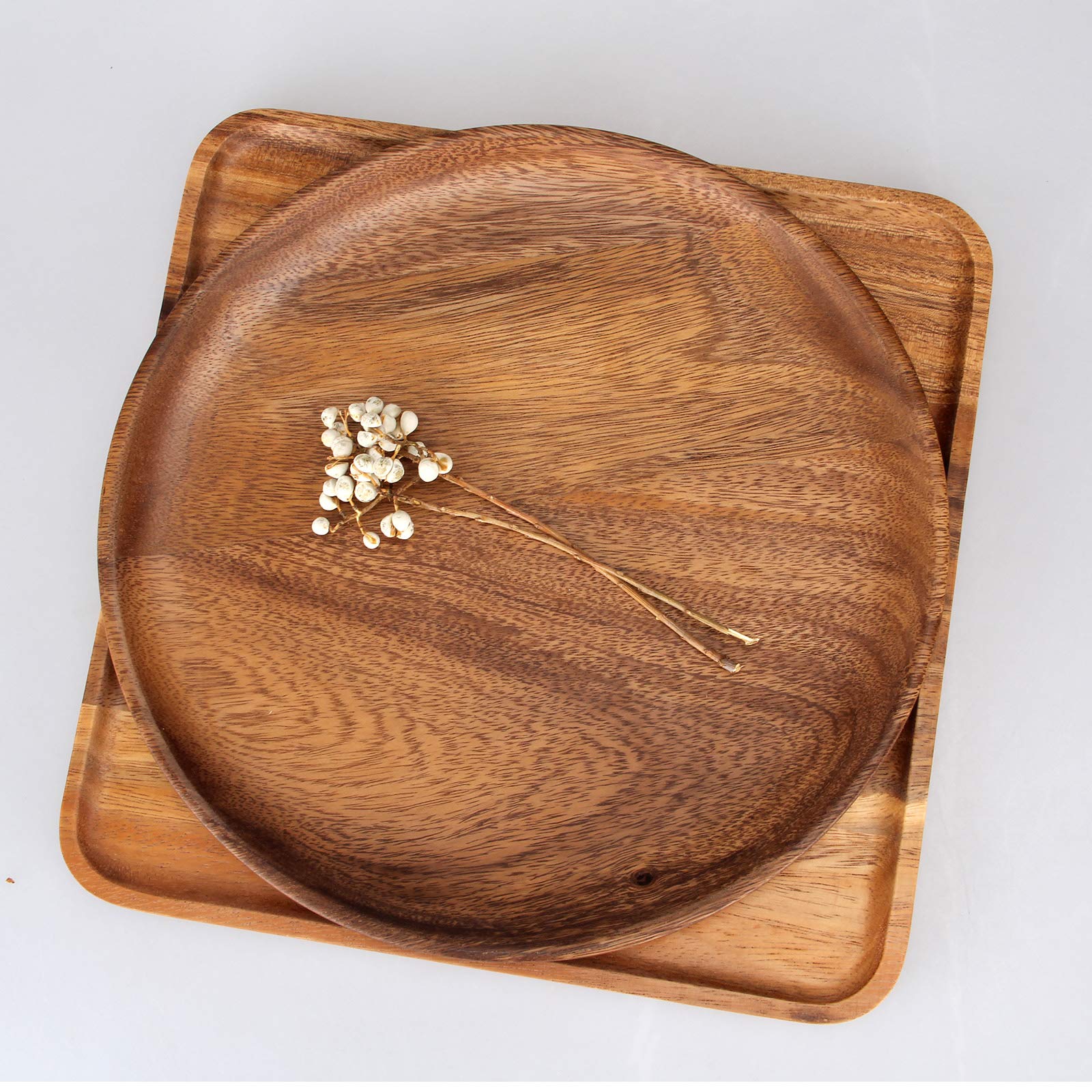 Ayiaren acacia wood dinner plates on a dining table to elevate everyday meals