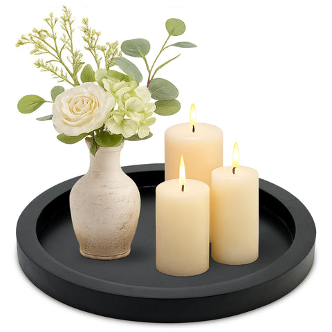 Ayiaren round tray on a coffee table, ideal for candles and small plants.
