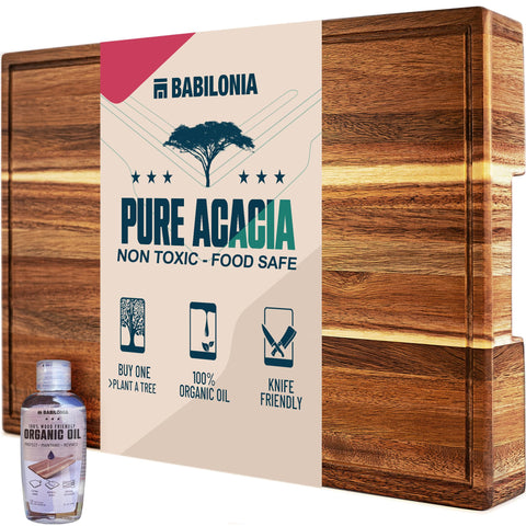 Babilonia Acacia cutting board features reversible design for multi-use prep and serving.