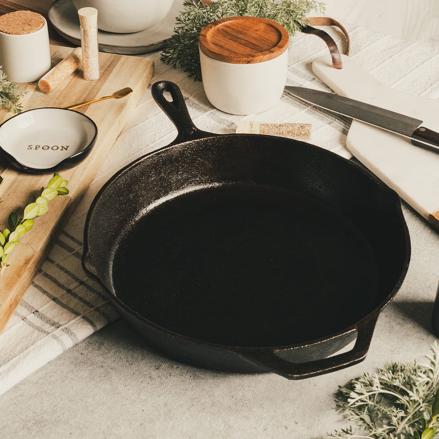 Backcountry Iron protective mitt with skillet supports safer handling during cooking.