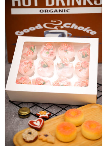 Bakepacker cupcake box in use at a bake sale demonstrates practical packaging.