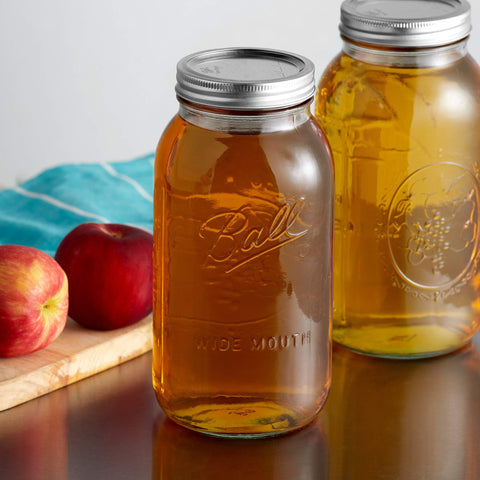 Ball 64oz wide-mouth jar in clear glass showcasing contents clearly.