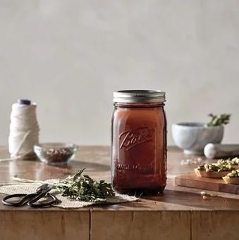 Ball jars on pantry shelf show light protection and flavor retention.