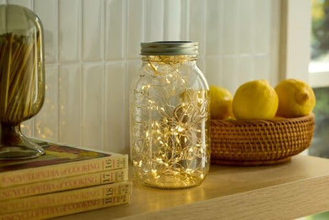 Ball jars in a row for sauces and pickles storage with airtight seal