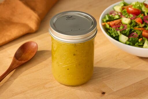 Ball jars for storage and preservation in kitchen, ideal for pickles.