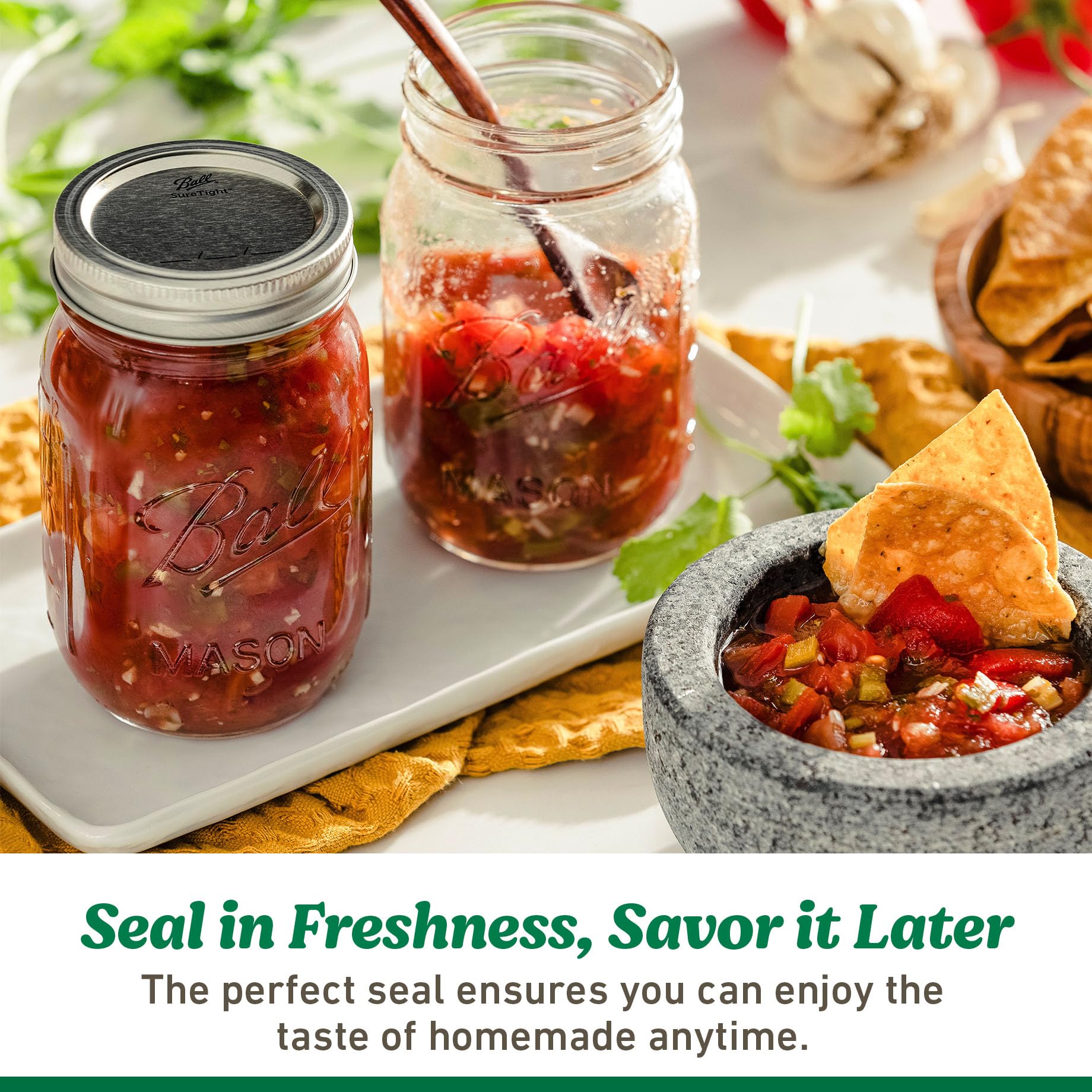 Ball lids in use with a glass mason jar for canning.