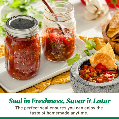 Ball lids in use with a glass mason jar for canning.