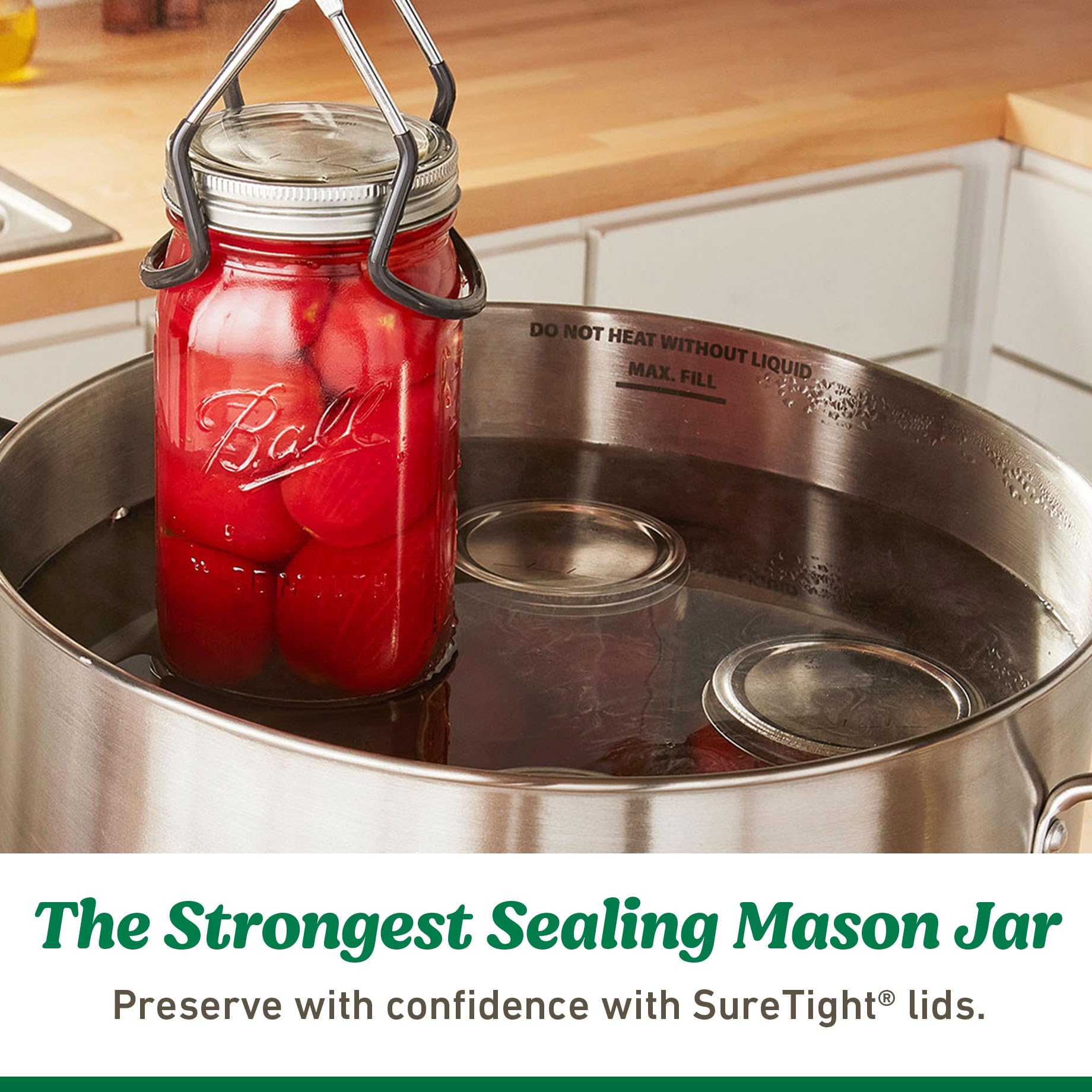 Lids placed beside mason jars on a kitchen counter.