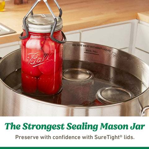 Lids placed beside mason jars on a kitchen counter.