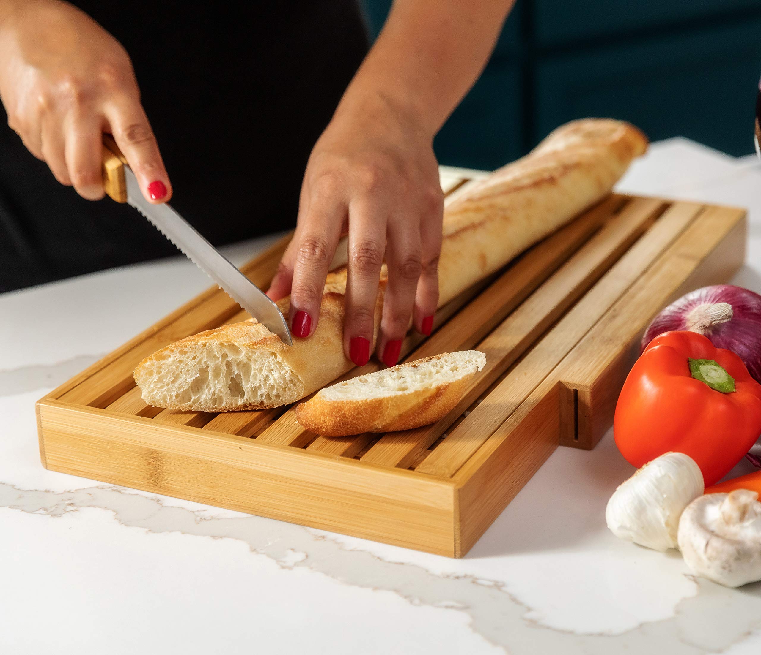 BAMBOO LAND bread slicer on a bamboo board for artisan loaves.