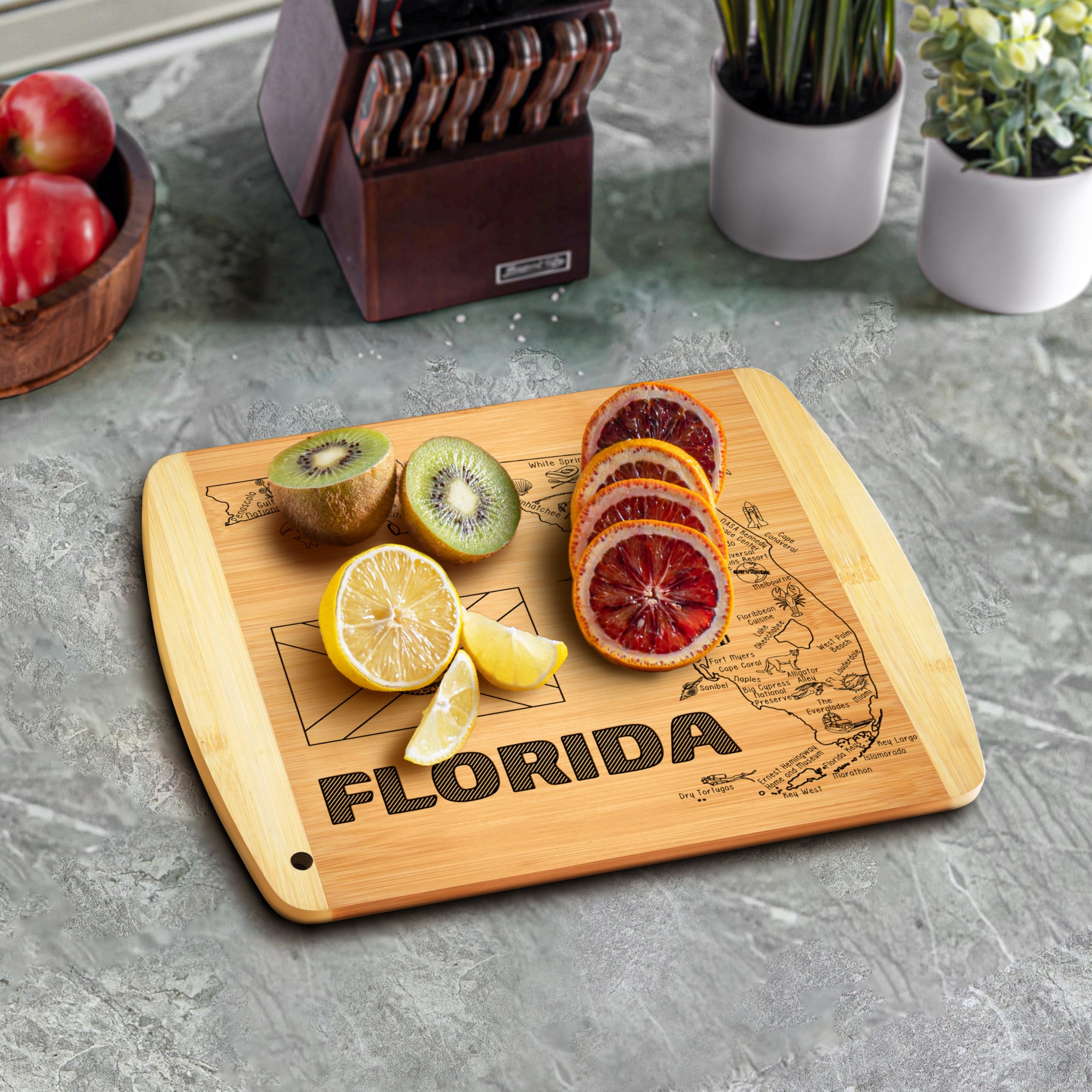Bambüsi Florida map cutting board serving setup ready for cheese, fruit, and snacks.